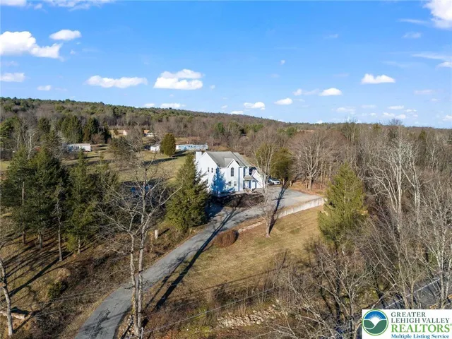 a view of a city street next to a building
