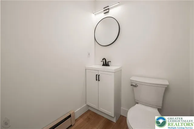 a spacious bedroom with a bed and a chandelier