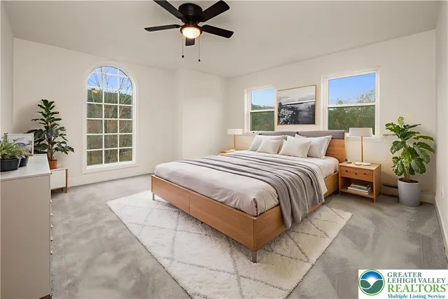 a living room with furniture and a chair