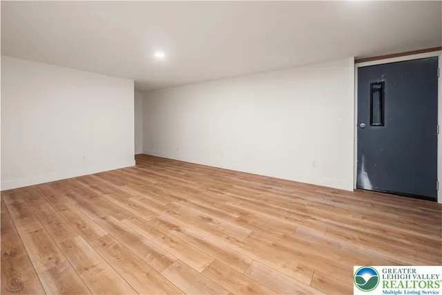 a view of a swimming pool with an ocean from a balcony