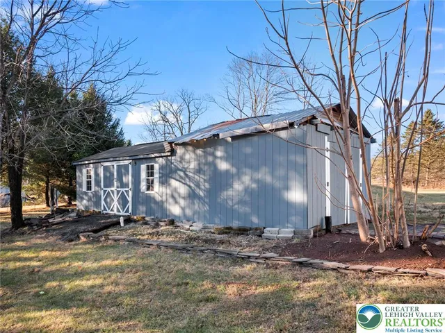 a view of a patio with table and chairs and potted plants