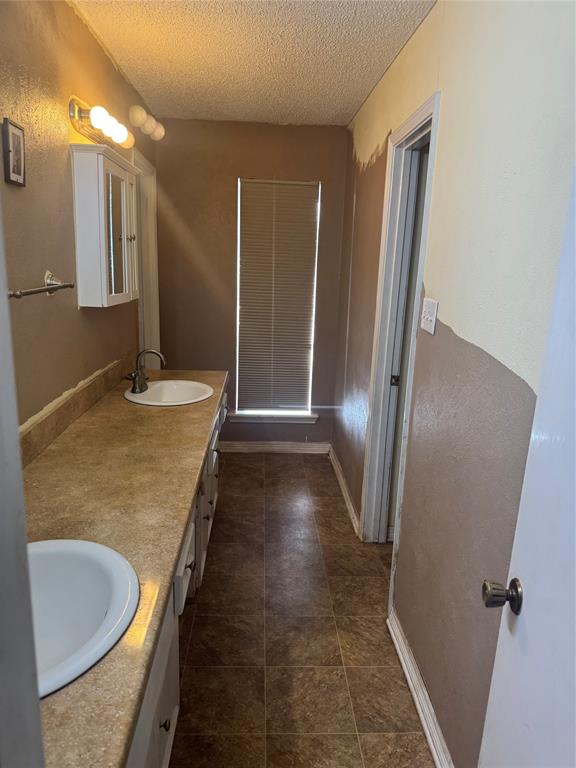 393 VZ County Road, Unit 4125 Ben Wheeler, TX 75754 - Photo 15 of 23 a bathroom with a granite countertop sink a toilet and a mirror