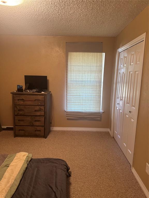 393 VZ County Road, Unit 4125 Ben Wheeler, TX 75754 - Photo 17 of 23 a living room with furniture and dresser with wooden floor