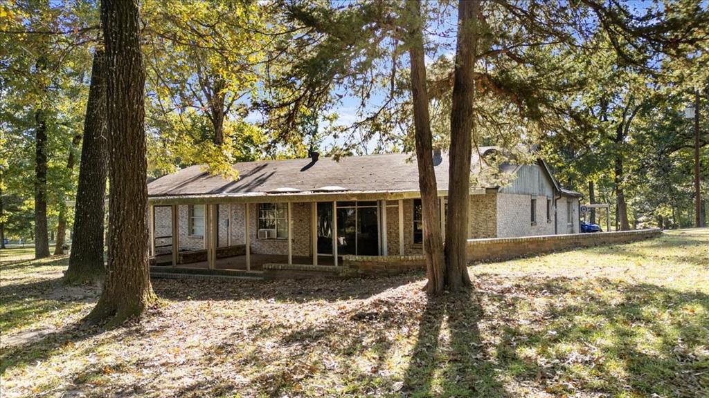 393 VZ County Road, Unit 4125 Ben Wheeler, TX 75754 - Photo 5 of 23 a front view of a house with a yard