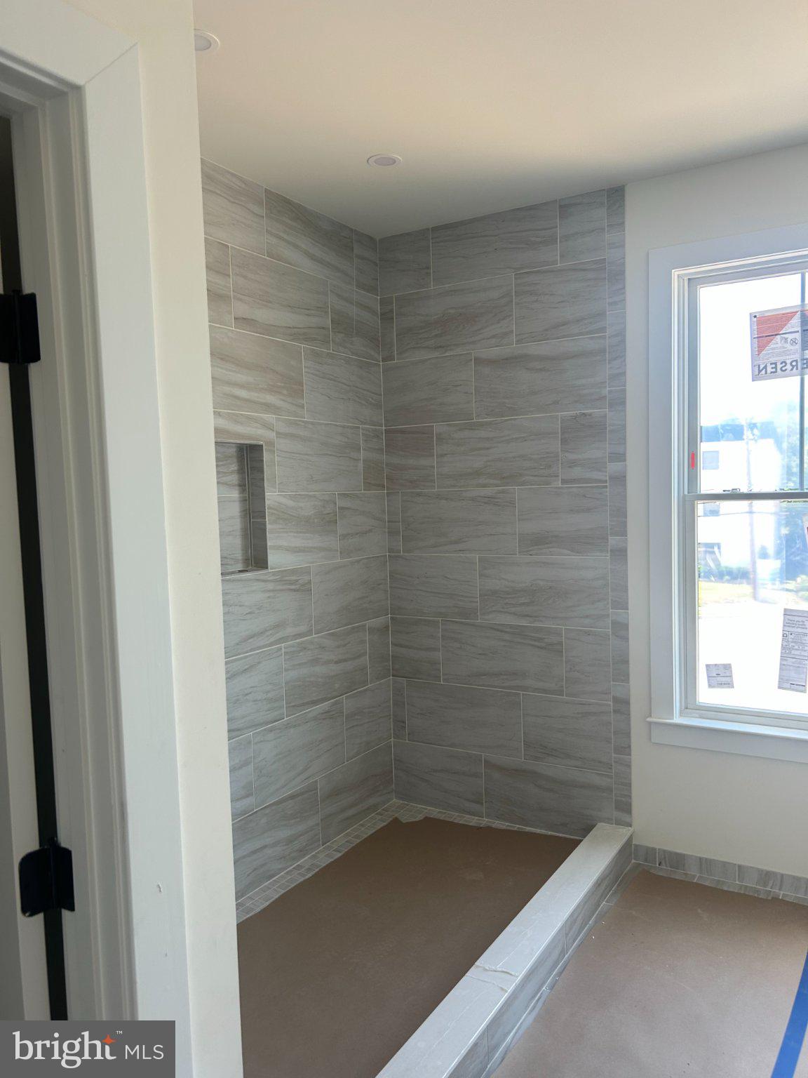 206 Sellew Road Annapolis, MD 21401 - Photo 5 of 10 Sleek, modern shower with elegant tiles.
