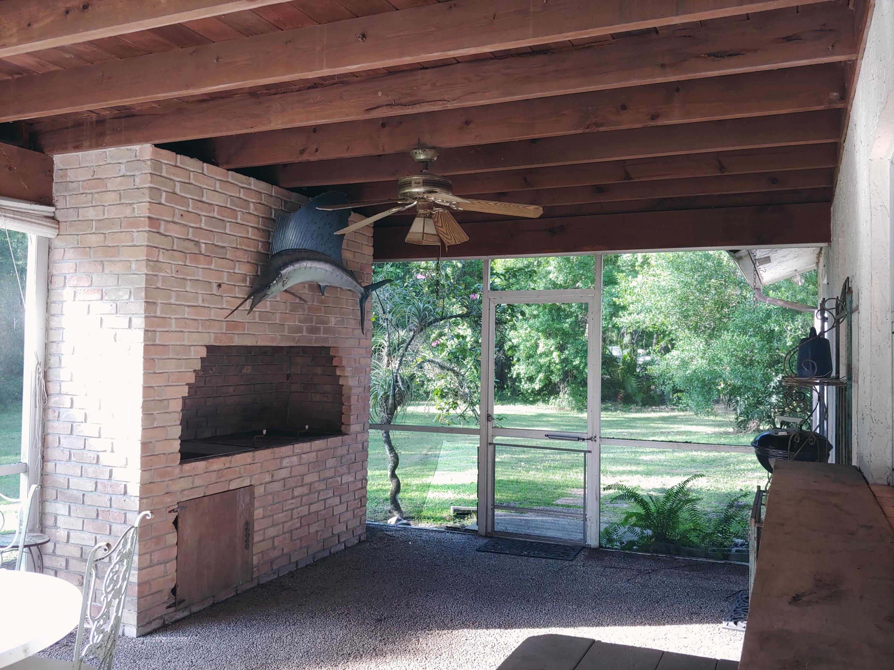 17127 Thunder Road Jupiter, FL 33478 - Photo 8 of 8 Brick patio kitchen