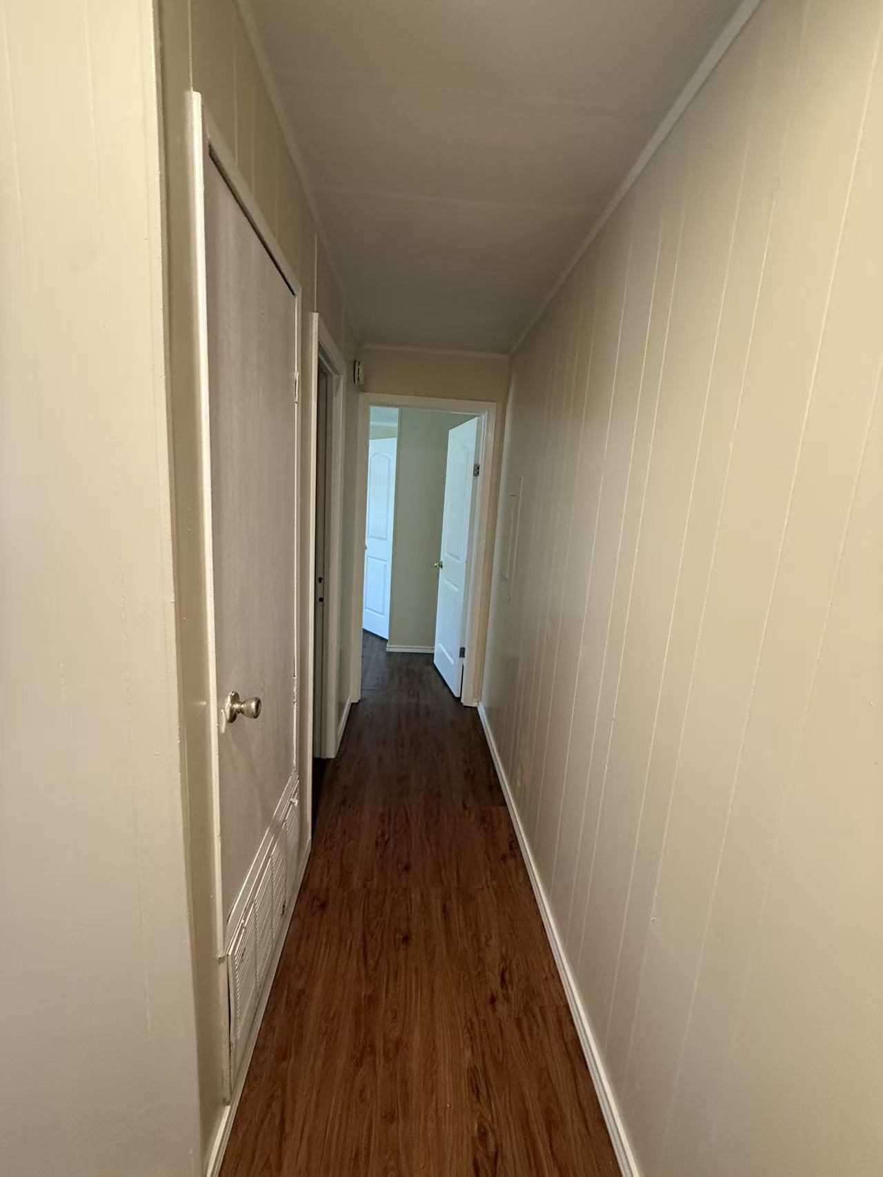23393 Nameless Road, Unit 113 Leander, TX 78641 - Photo 12 of 16 Hall featuring dark wood-type flooring and wooden walls