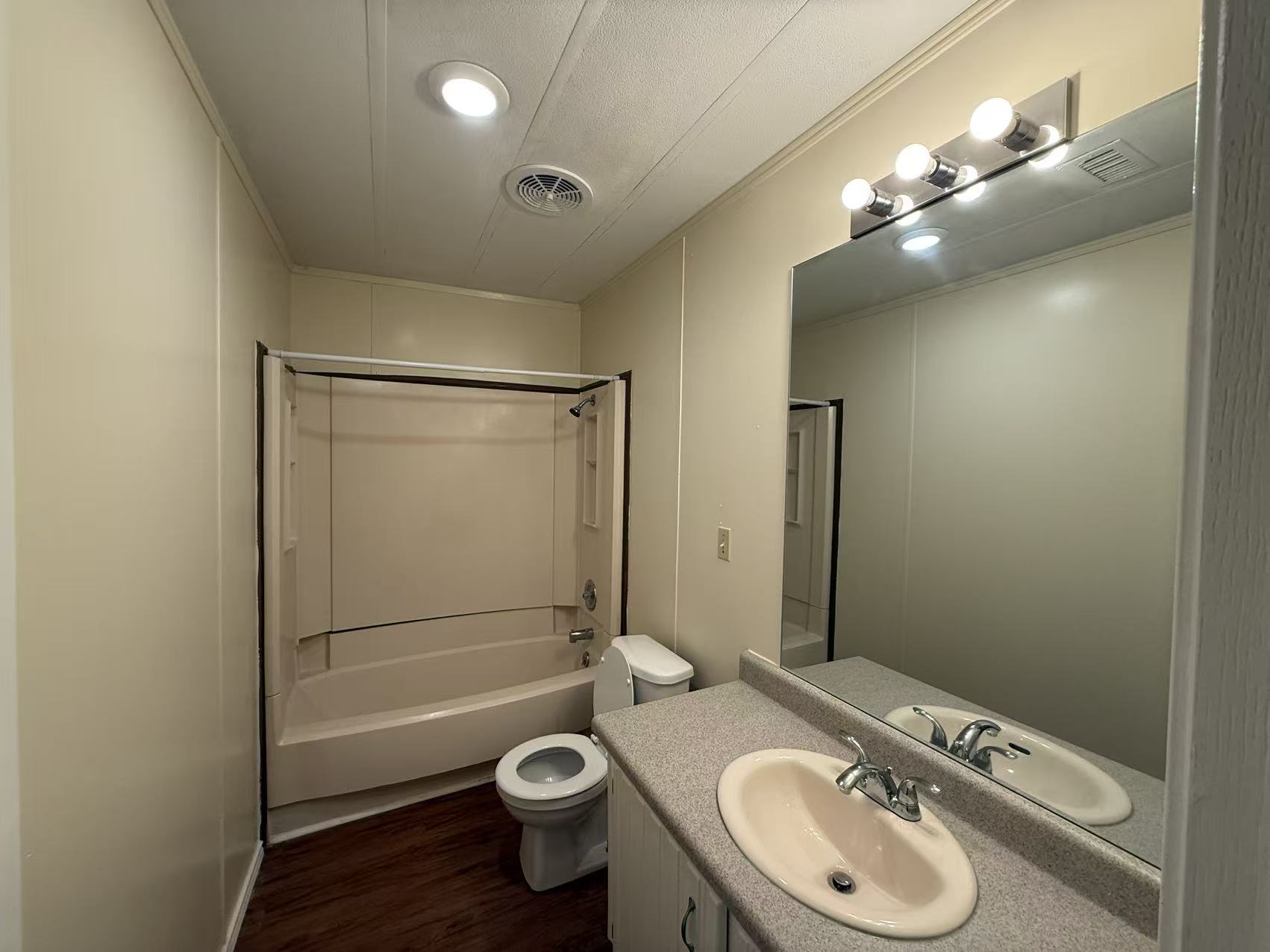 23393 Nameless Road, Unit 113 Leander, TX 78641 - Photo 13 of 16 Full bathroom with vanity, bathtub / shower combination, dark wood finished floors, and ornamental molding