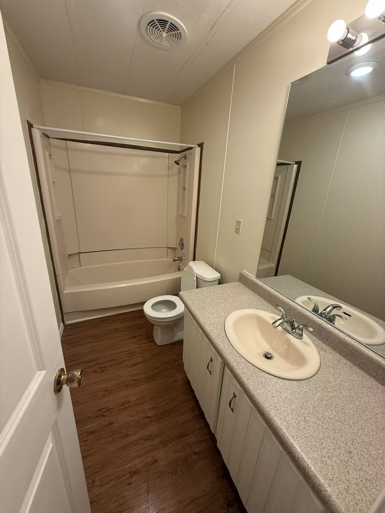 23393 Nameless Road, Unit 113 Leander, TX 78641 - Photo 14 of 16 Full bath featuring vanity, bathing tub / shower combination, and dark wood-style flooring
