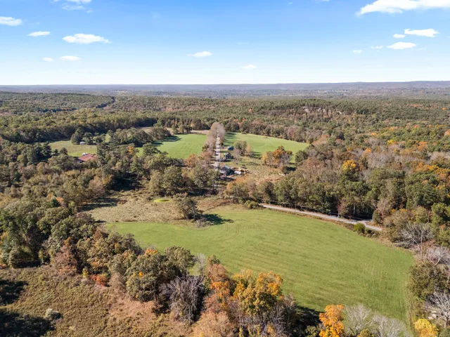 a view of a yard with a mountain