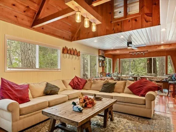 a living room with furniture and a large window
