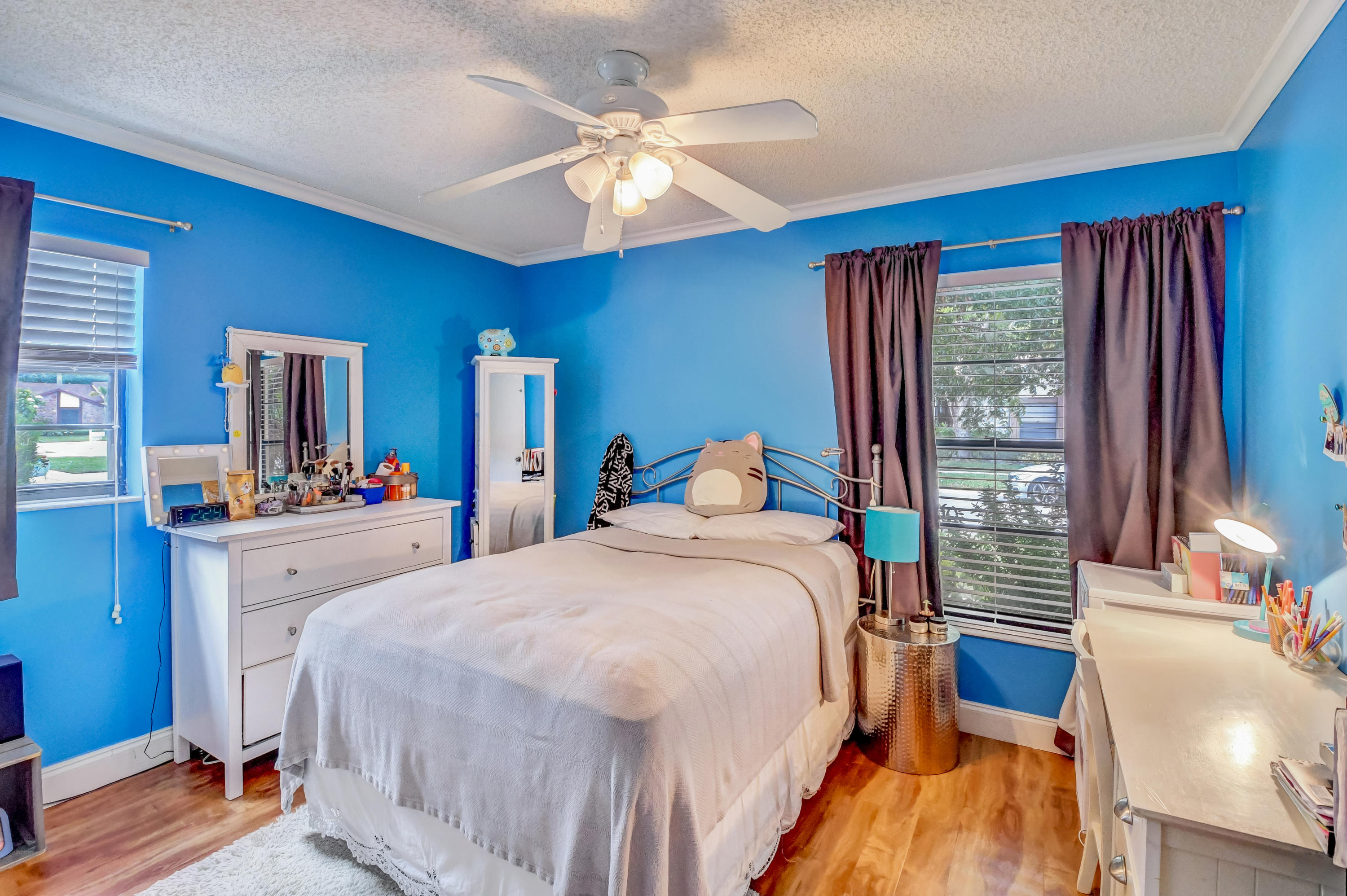 11682 Springflower Place Boca Raton, FL 33428 - Photo 28 of 66 a bedroom with a large bed a chandelier and dresser