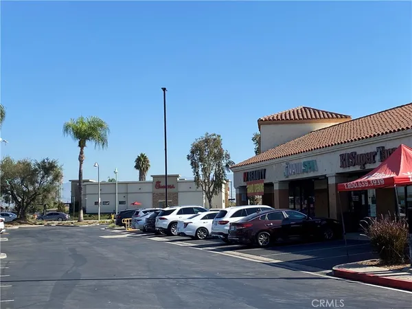 a view of a city street with cars