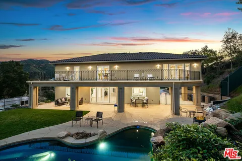 a view of entryway with wooden floor and stairs