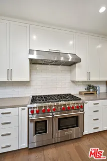 a spacious bedroom with a large bed and a couch