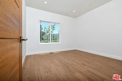 a view of a chairs and table in the balcony
