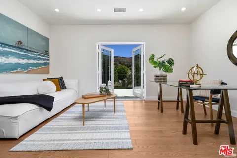 a view of a house with a yard and garden