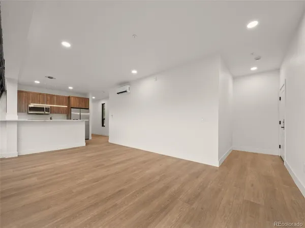 a view of kitchen with wooden floor