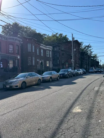 a view of street with parked cars