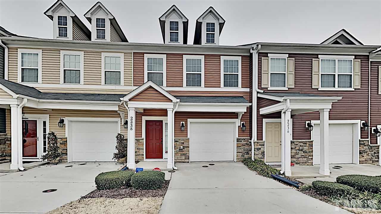2238 Stoney Spring Drive Raleigh, NC 27610 - Photo 1 of 11 a front view of a house with a yard