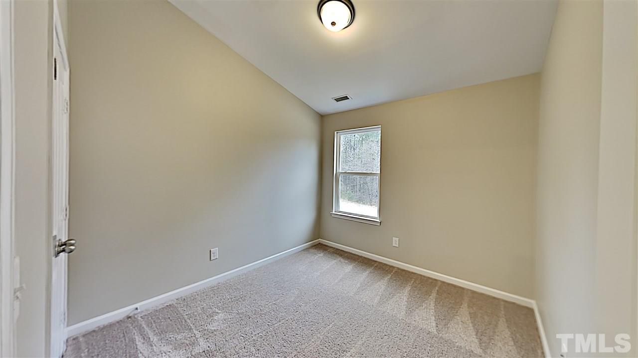 2238 Stoney Spring Drive Raleigh, NC 27610 - Photo 8 of 11 a view of an empty room with a window