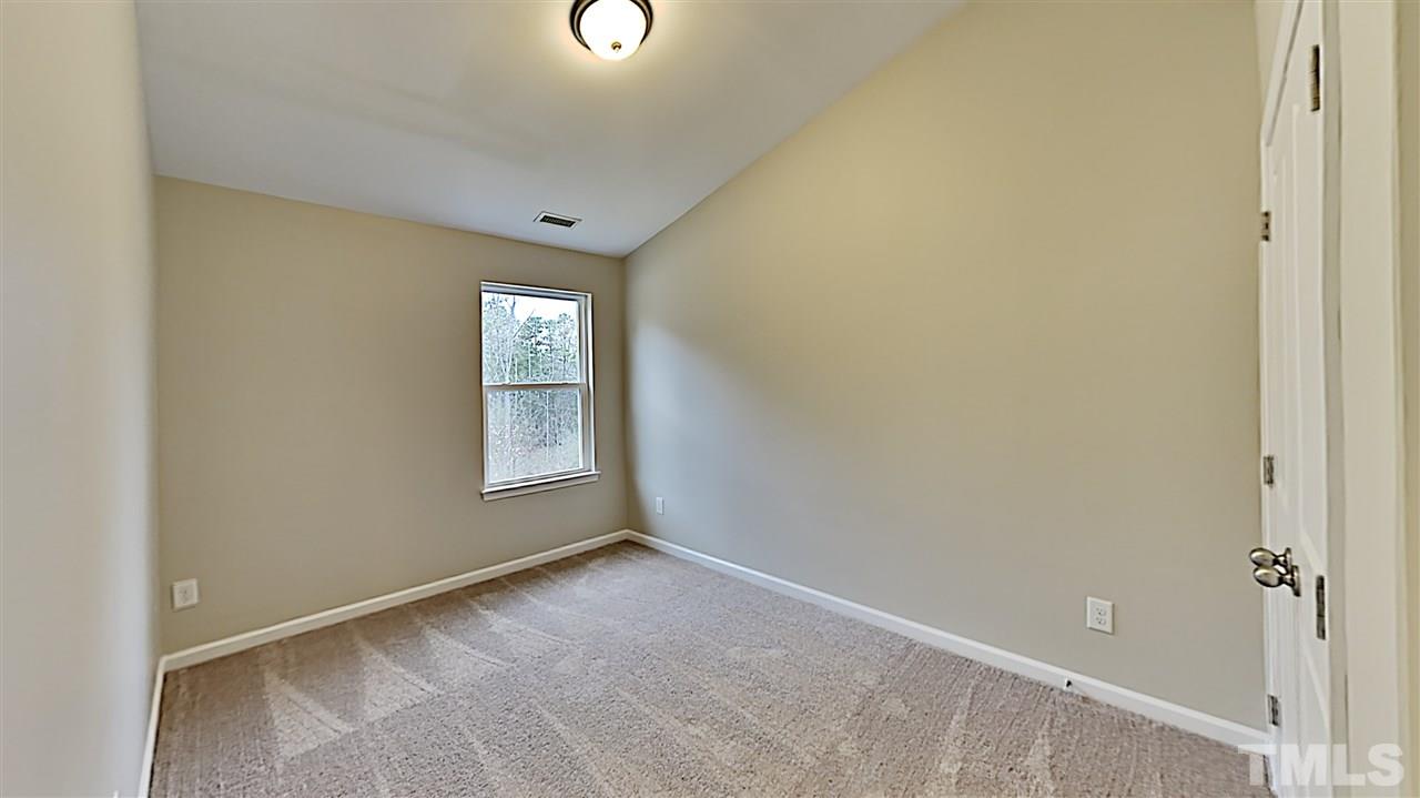 2238 Stoney Spring Drive Raleigh, NC 27610 - Photo 9 of 11 a view of an empty room with window
