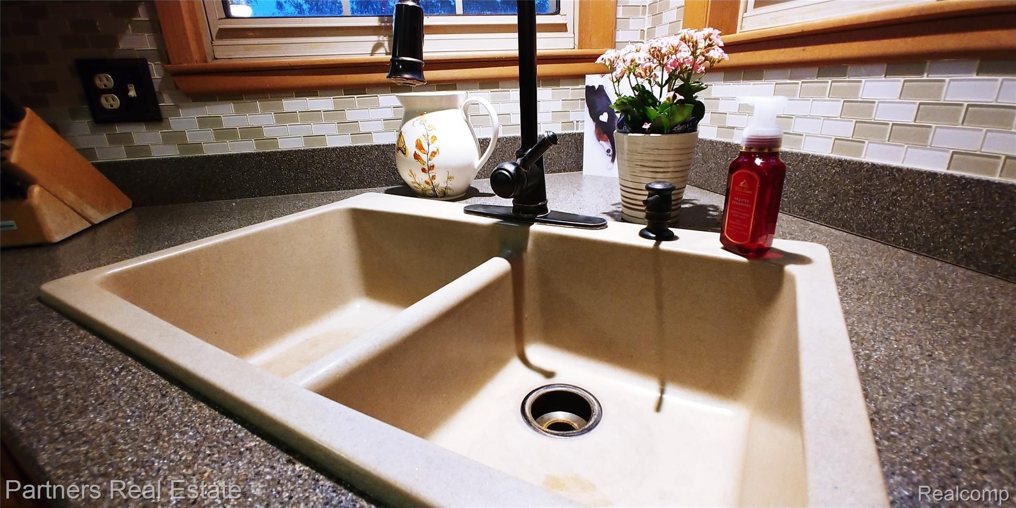 7451 Sanford Road Howell, MI 48855 - Photo 19 of 30 Double bowl kitchen sink and newer CorianĀ® countertops...
