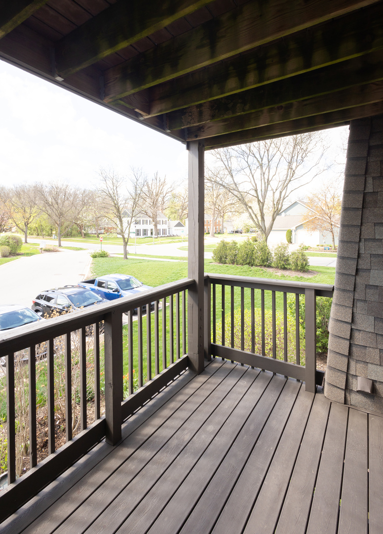 1420 Stonebridge Circle, Unit 5N Wheaton, IL 60189 - Photo 13 of 14 a view of a wooden deck with a ocean view