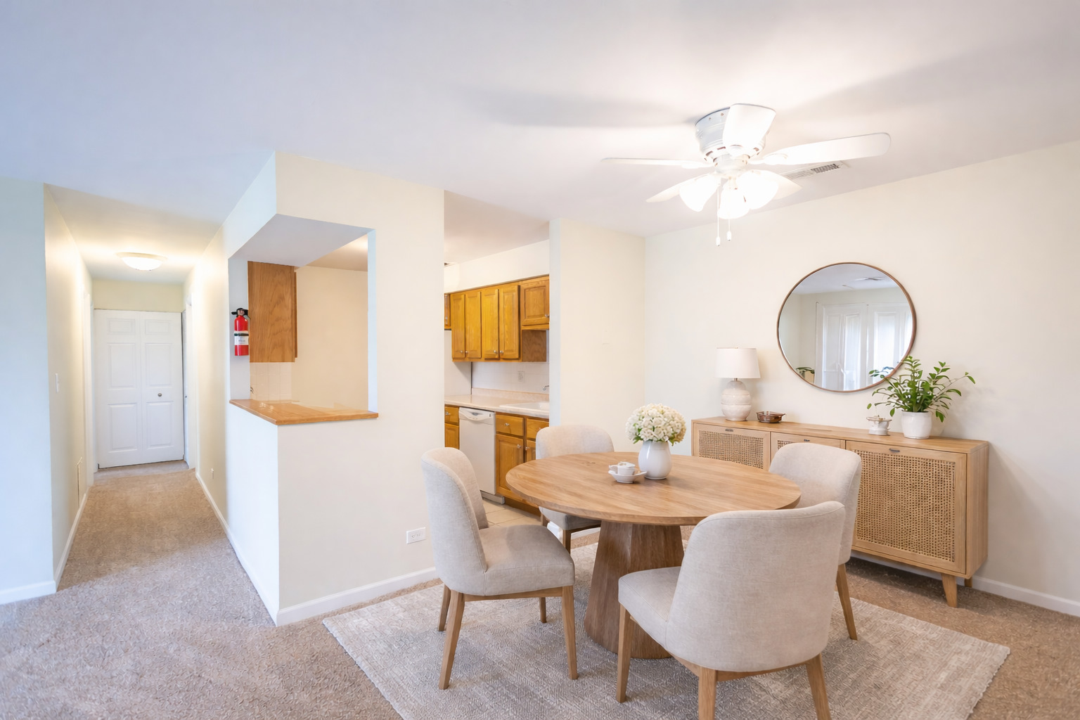 1420 Stonebridge Circle, Unit 5N Wheaton, IL 60189 - Photo 4 of 14 a dining room with furniture a mirror and wooden floor
