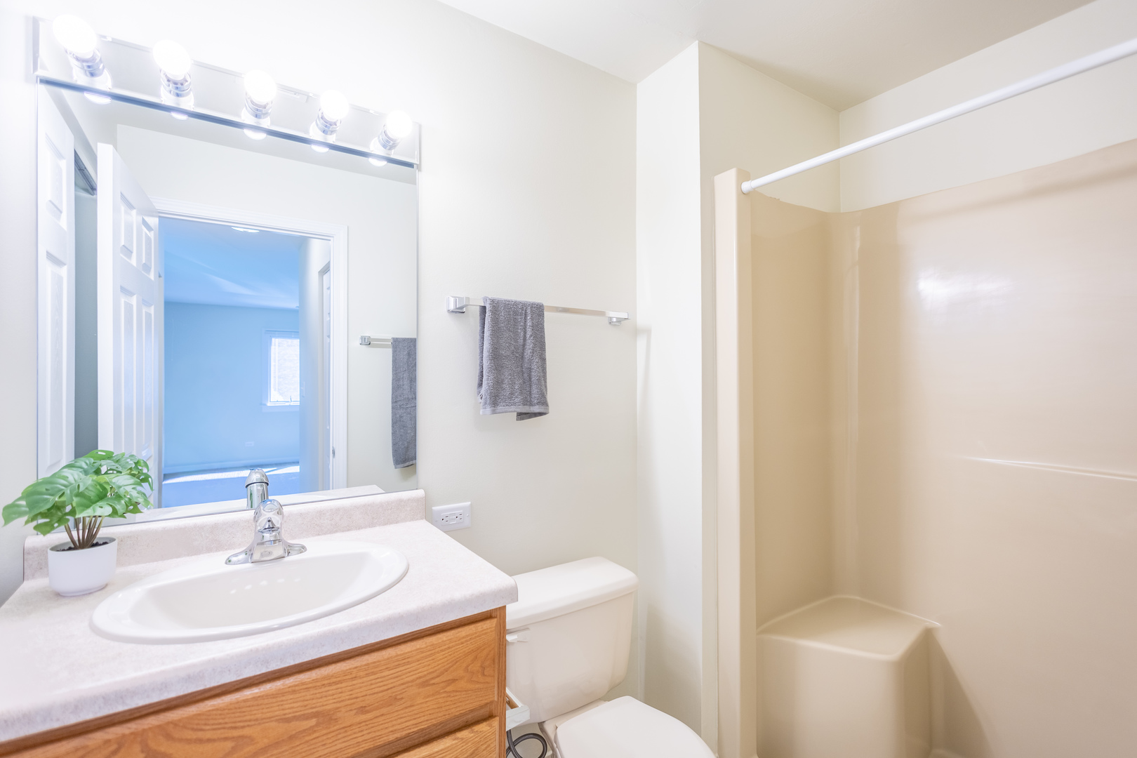 1420 Stonebridge Circle, Unit 5N Wheaton, IL 60189 - Photo 10 of 14 a bathroom with a sink toilet and mirror