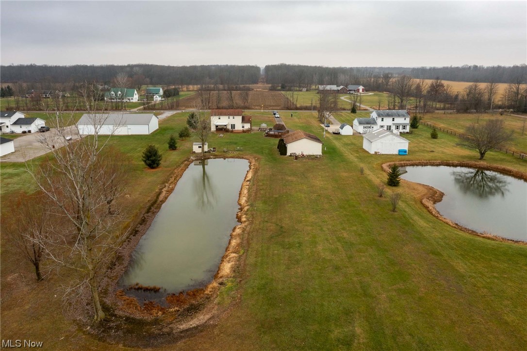 3465 Yost Road Litchfield, OH 44253 - Photo 23 of 27 Drone / aerial view featuring a water view