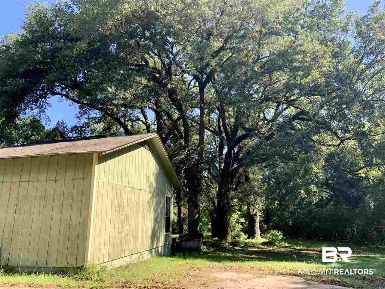 17071 County Road 52 Silverhill, AL 36576 - Photo 37 of 44 Parking pad, well, large trees