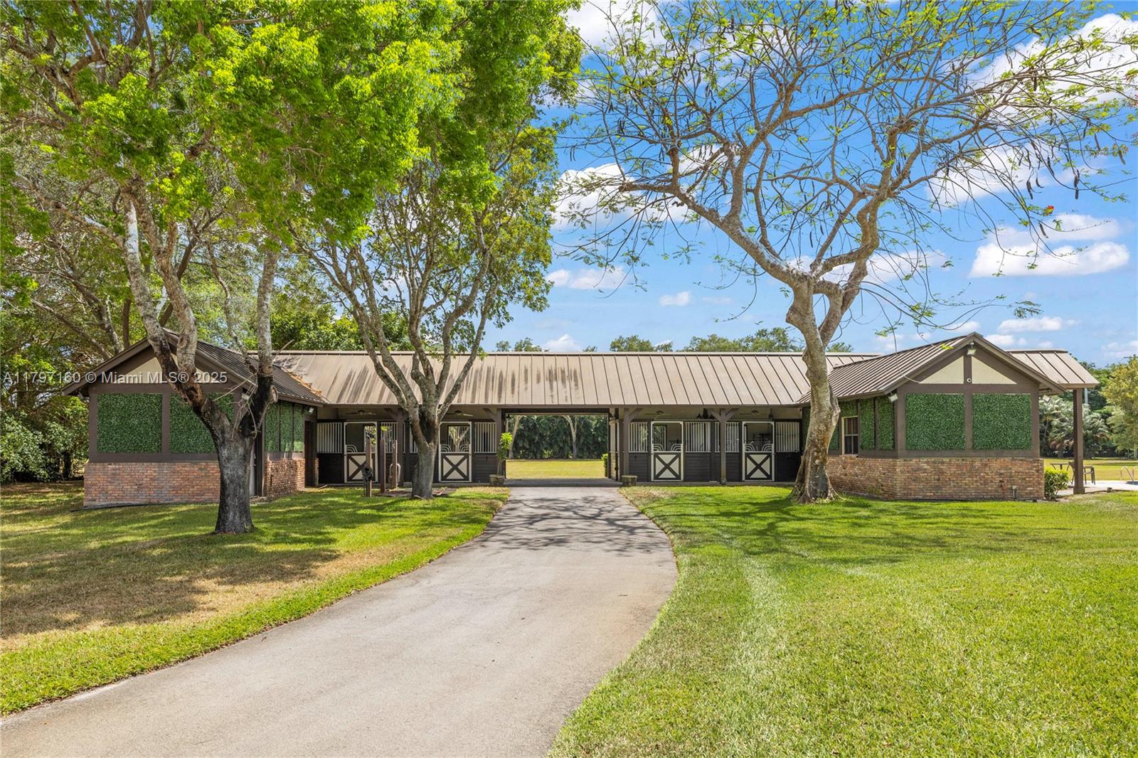8700 Surrey Lane Boca Raton, FL 33496 - Photo 5 of 10 a view of a house with a yard