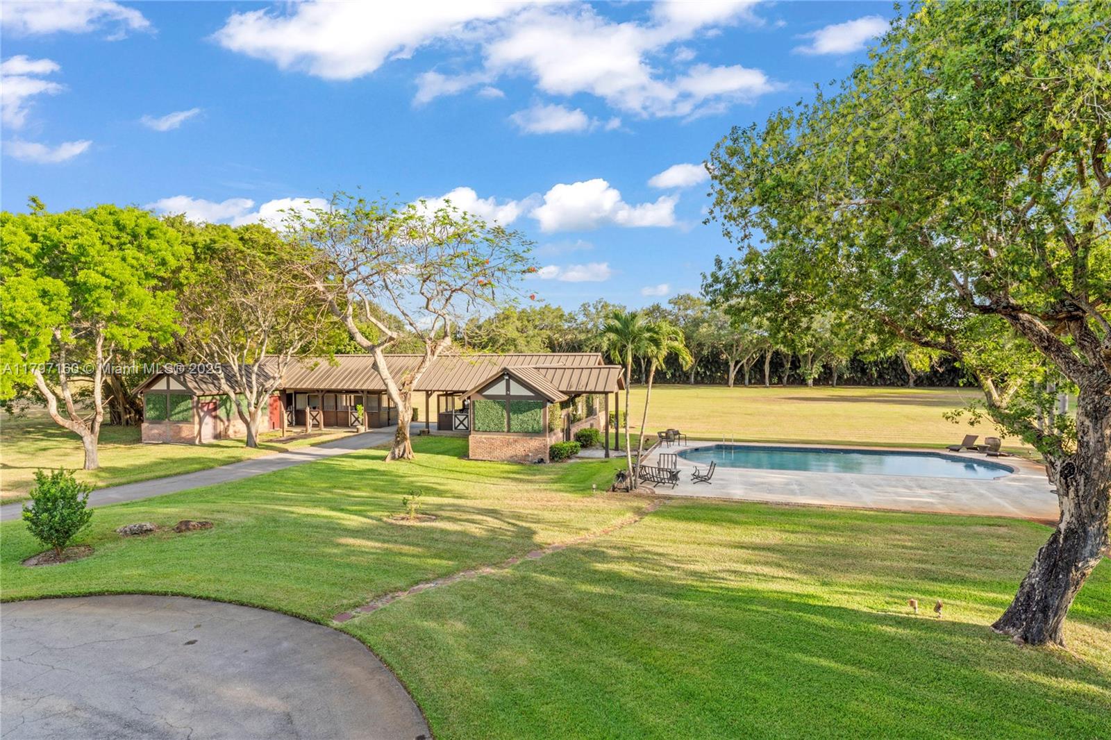 8700 Surrey Lane Boca Raton, FL 33496 - Photo 6 of 10 a view of a house with a big yard