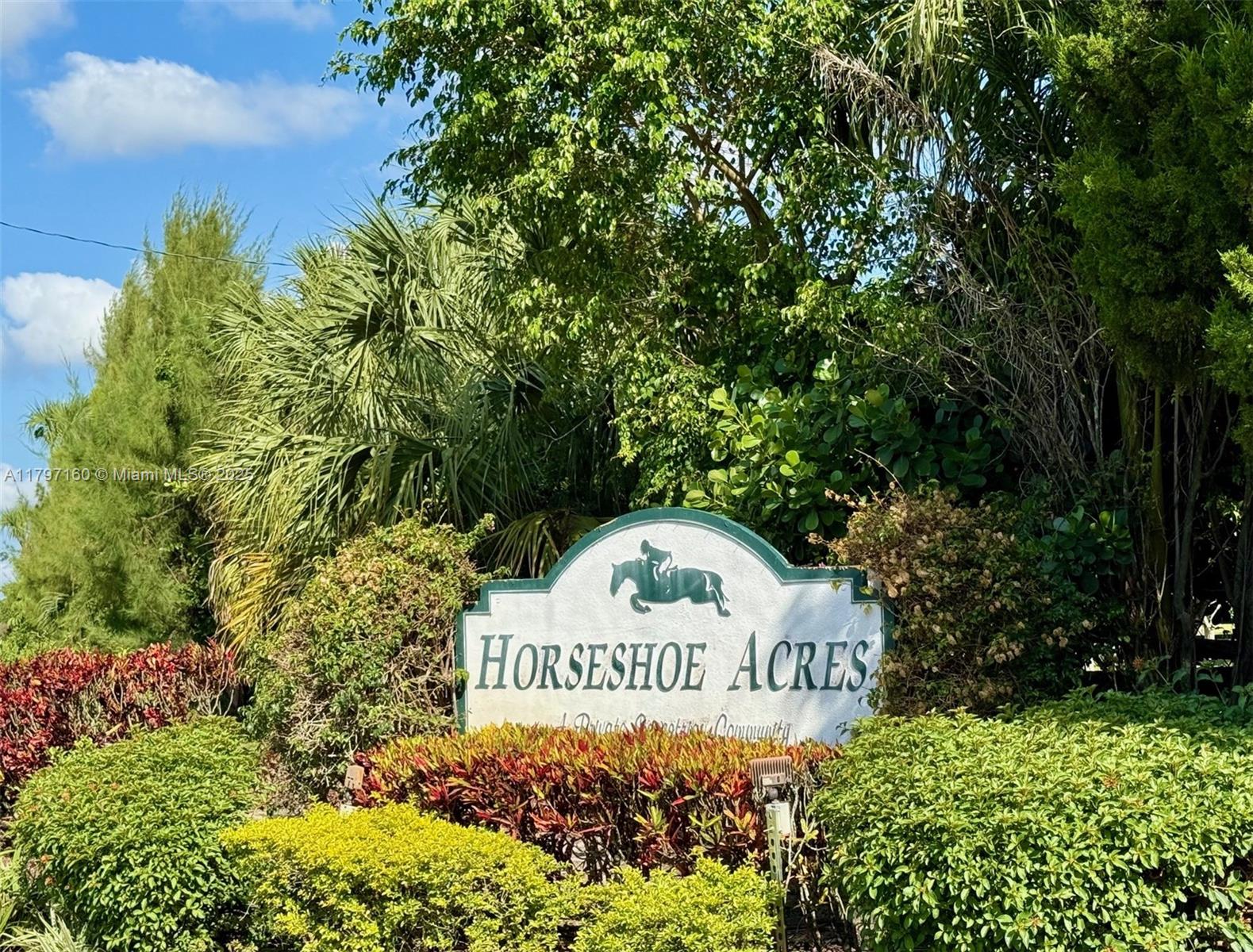 8700 Surrey Lane Boca Raton, FL 33496 - Photo 7 of 10 a sign on the side of a road