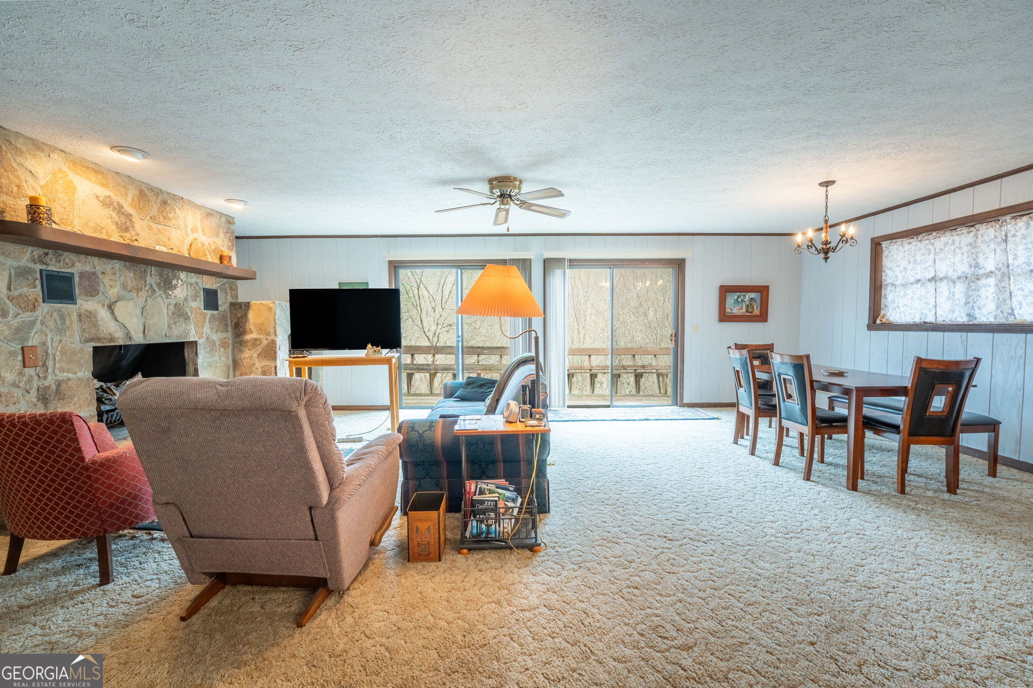 375 Western Way Rabun Gap, GA 30568 - Photo 12 of 51 a living room with furniture and a flat screen tv