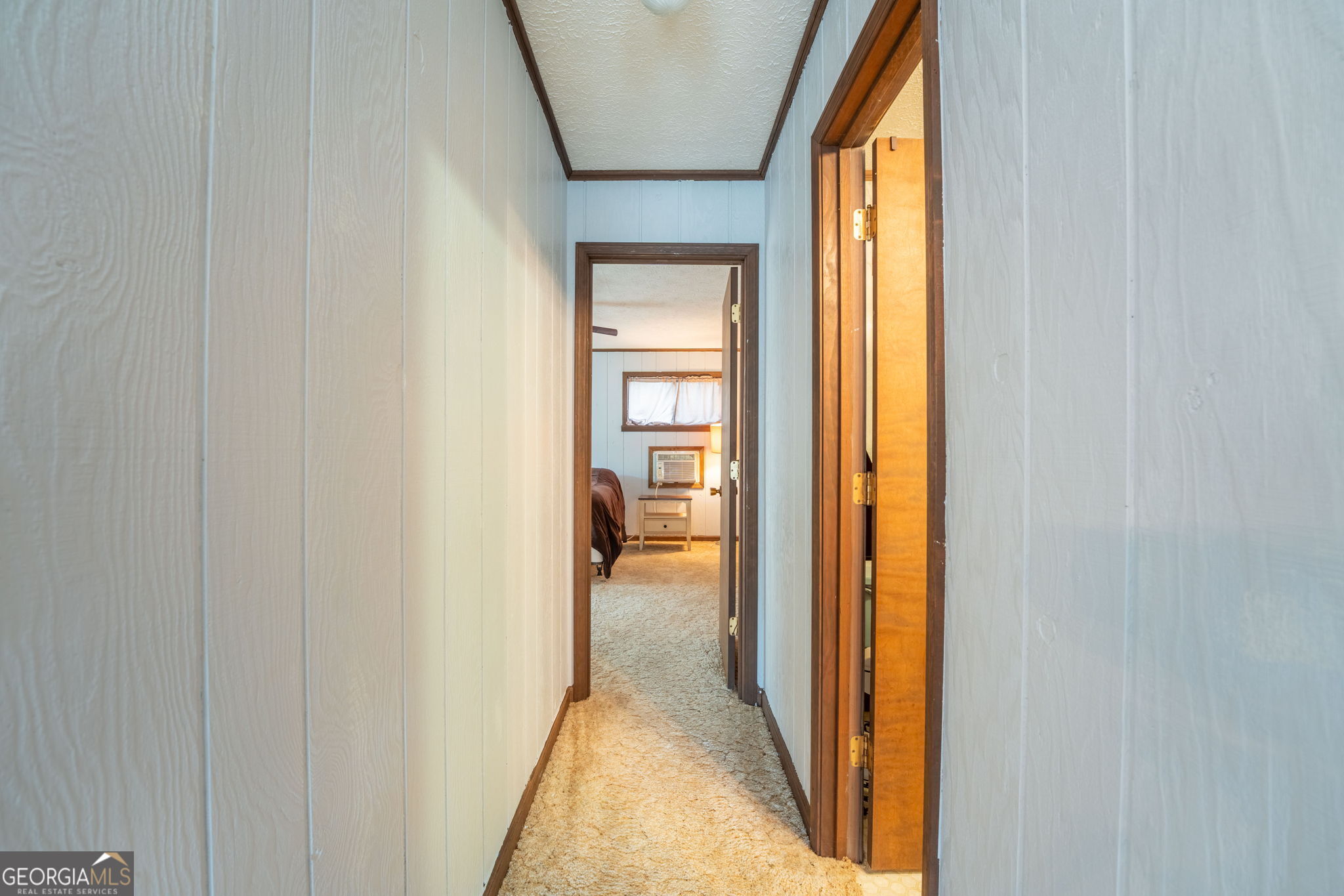 375 Western Way Rabun Gap, GA 30568 - Photo 20 of 51 a view of a hallway with wooden shelves
