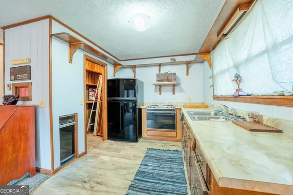 a view of a bathroom with sink and mirror