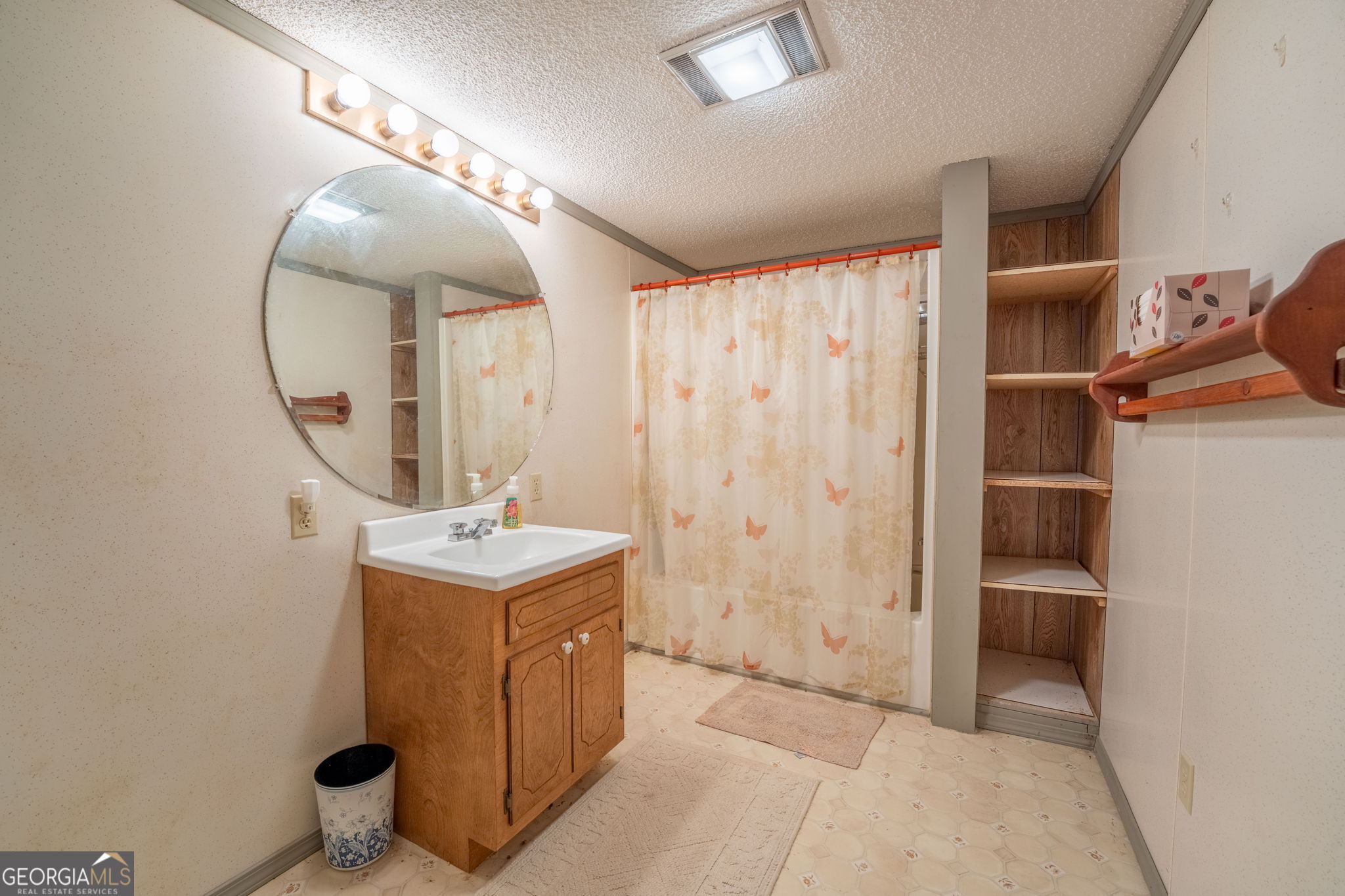 375 Western Way Rabun Gap, GA 30568 - Photo 32 of 51 a view of a bathroom with sink and mirror