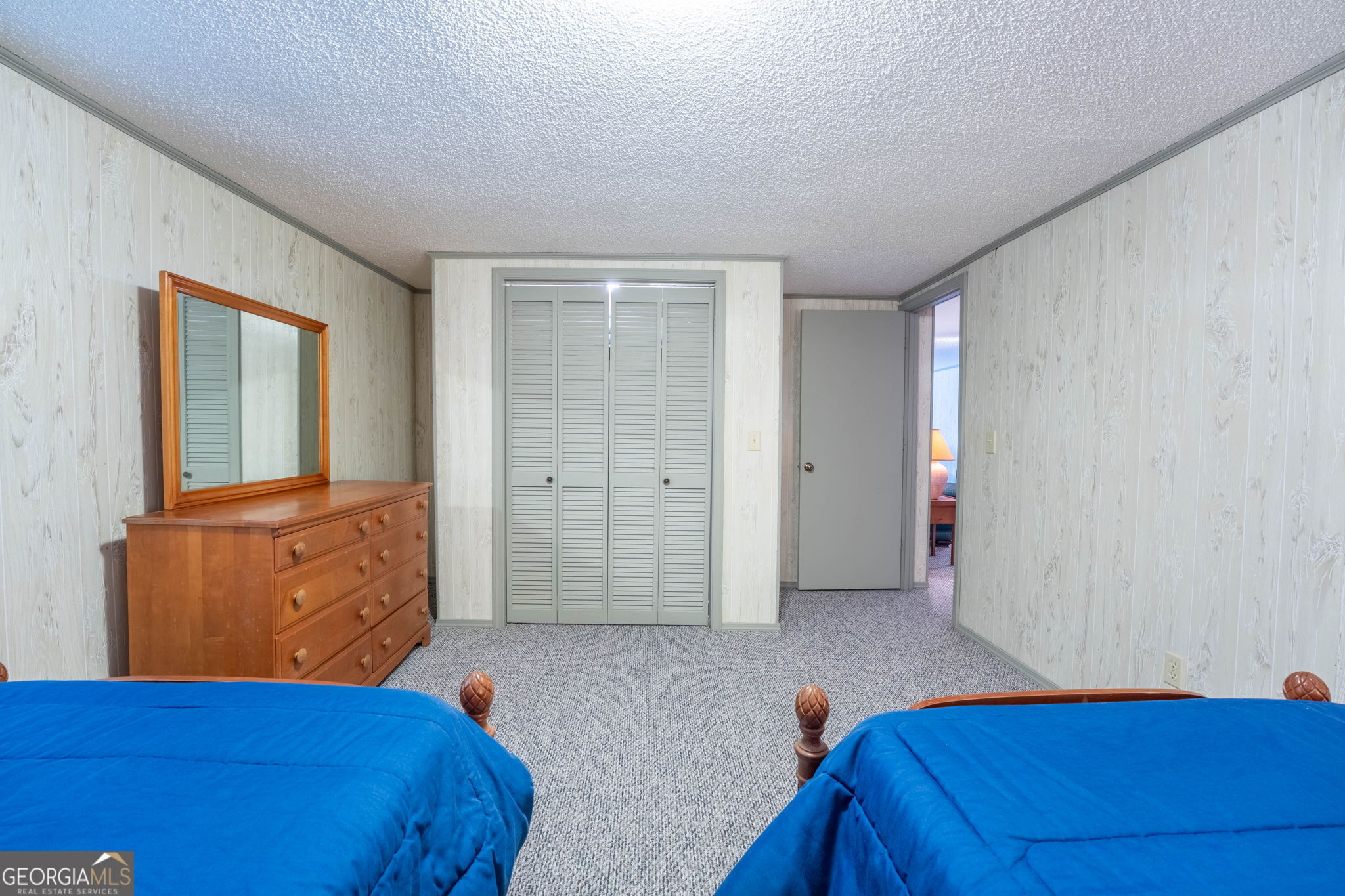 375 Western Way Rabun Gap, GA 30568 - Photo 36 of 51 a bedroom with a bed and a dresser