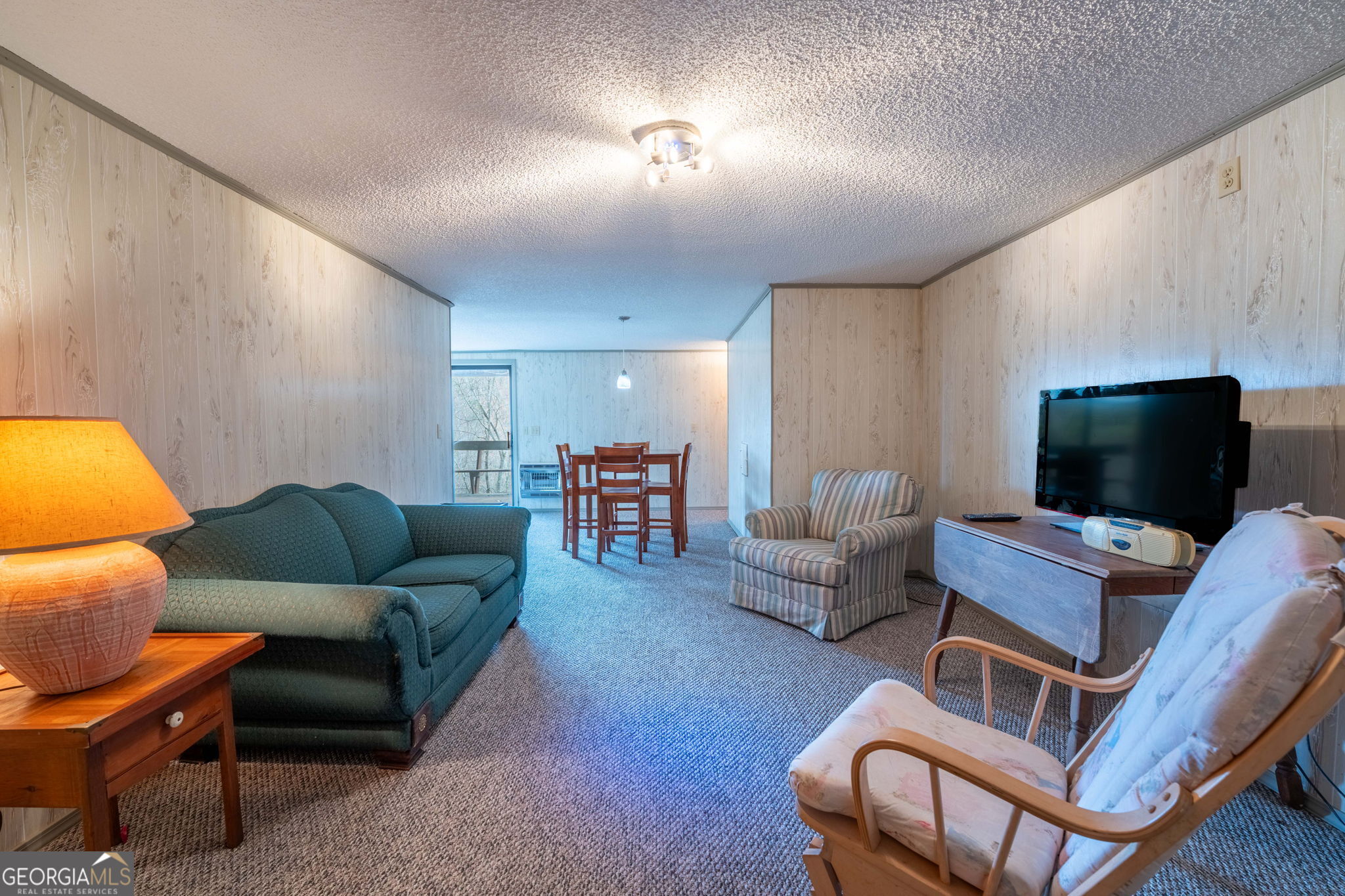 375 Western Way Rabun Gap, GA 30568 - Photo 44 of 51 a living room with furniture and a flat screen tv