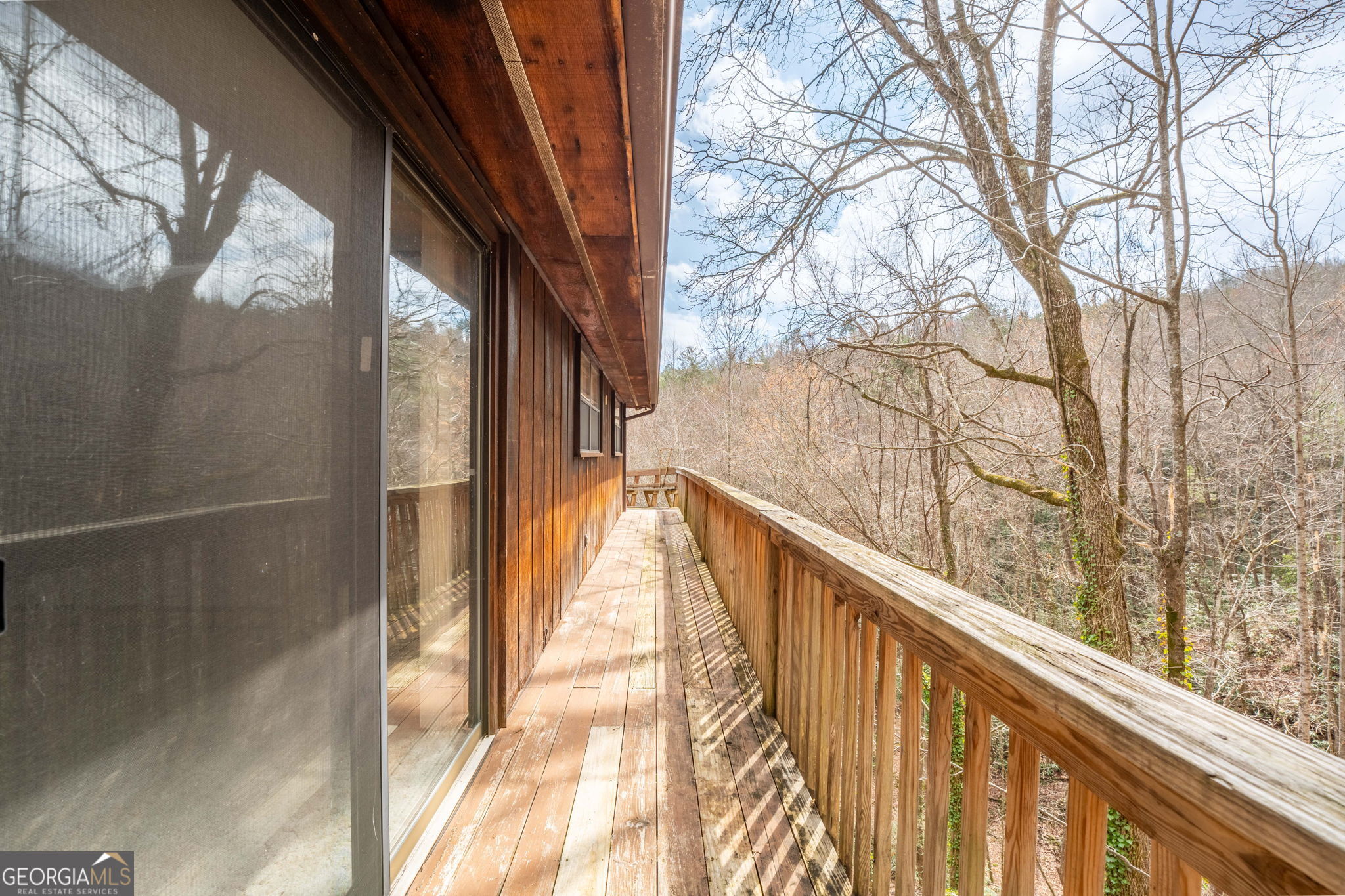 375 Western Way Rabun Gap, GA 30568 - Photo 48 of 51 a view of balcony with wooden floor and tree