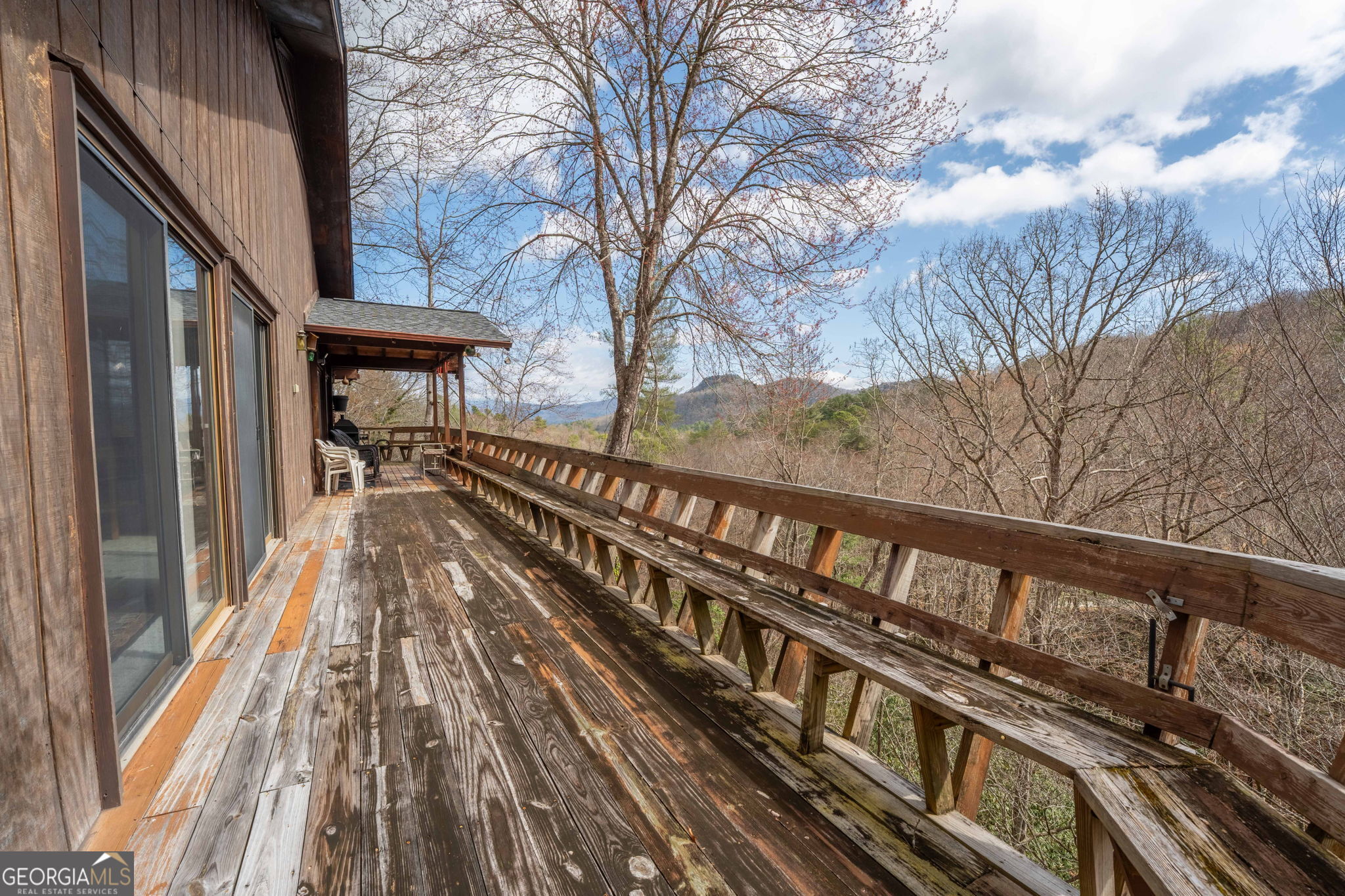 375 Western Way Rabun Gap, GA 30568 - Photo 49 of 51 a view of a balcony with wooden floor and fence