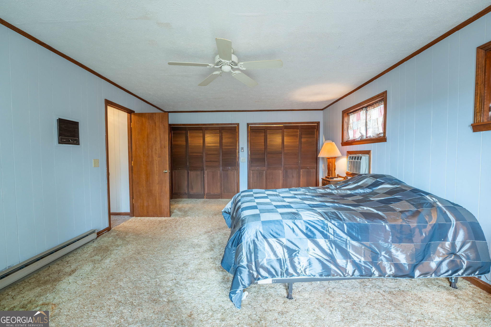 375 Western Way Rabun Gap, GA 30568 - Photo 6 of 51 a bedroom with a bed and window