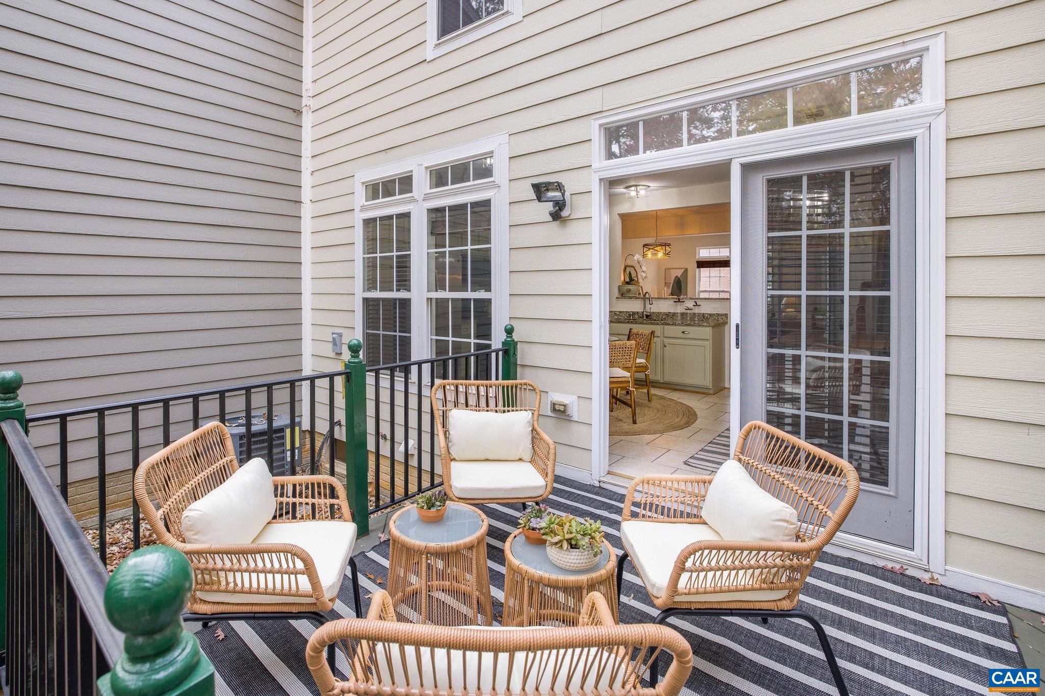 843 Rainier Road Charlottesville, VA 22903 - Photo 28 of 41 a view of a patio with couches chairs and wooden floor