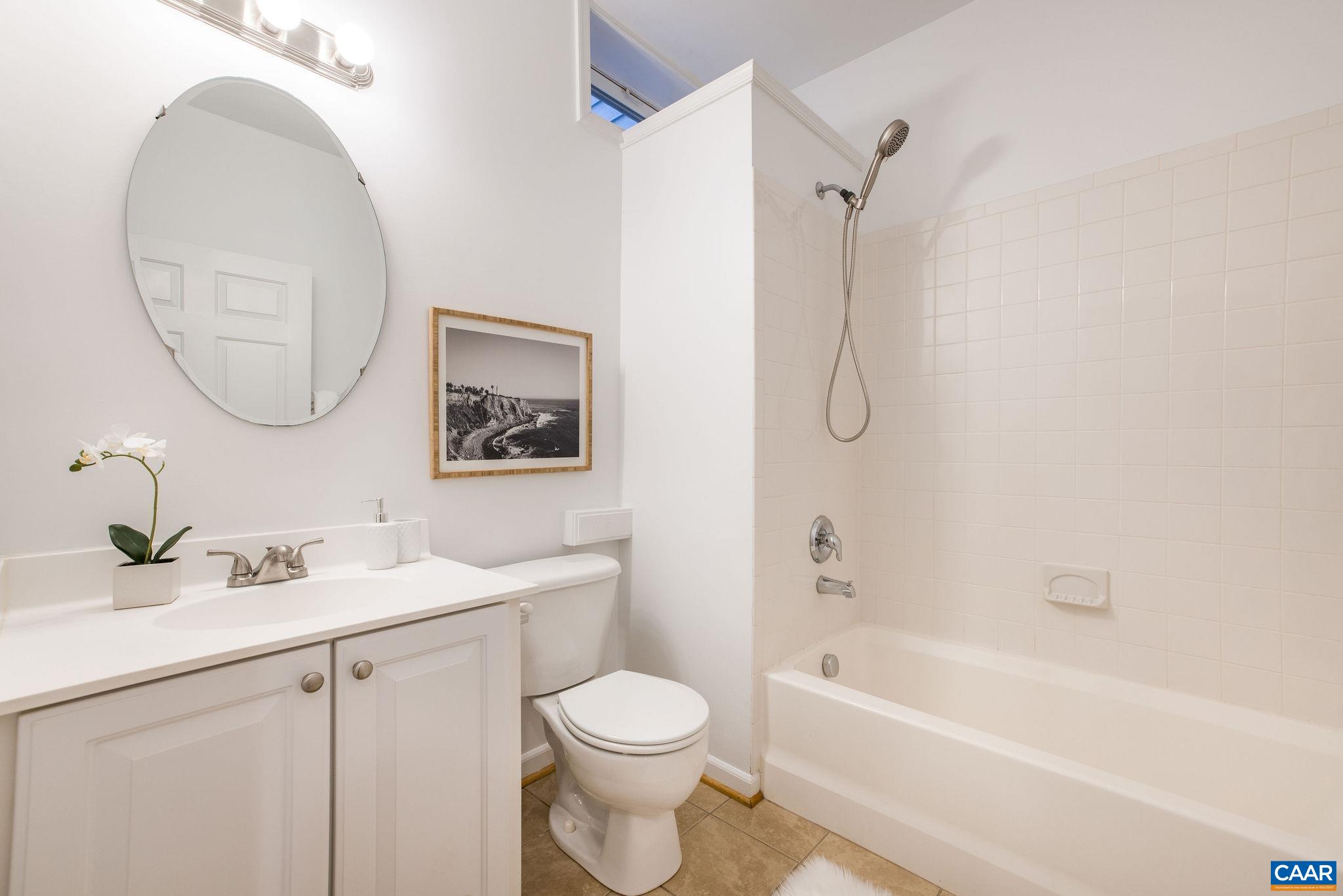 843 Rainier Road Charlottesville, VA 22903 - Photo 9 of 41 a bathroom with a sink toilet and a bathtub