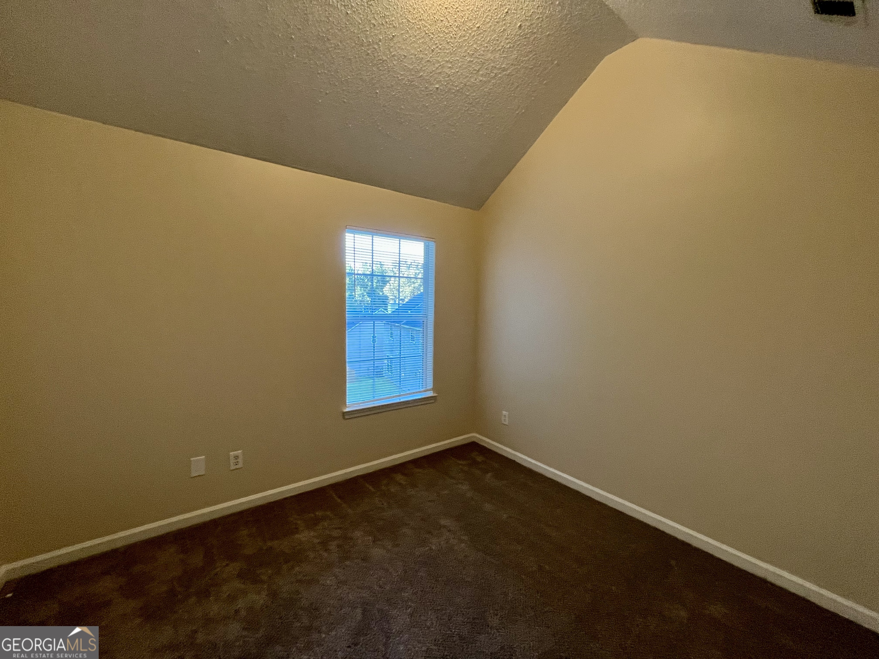 260 Windscape Drive Covington, GA 30016 - Photo 12 of 14 a view of an empty room with a window