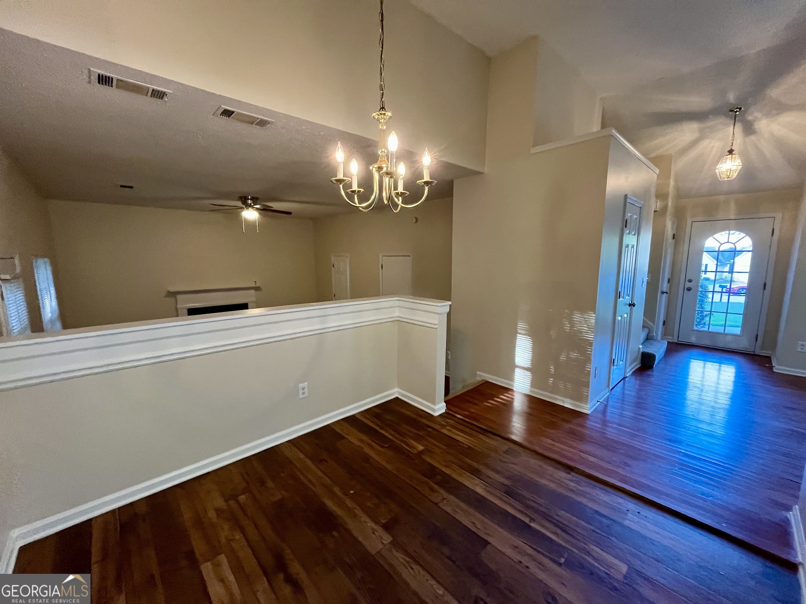 260 Windscape Drive Covington, GA 30016 - Photo 5 of 14 a view of a room with wooden floor
