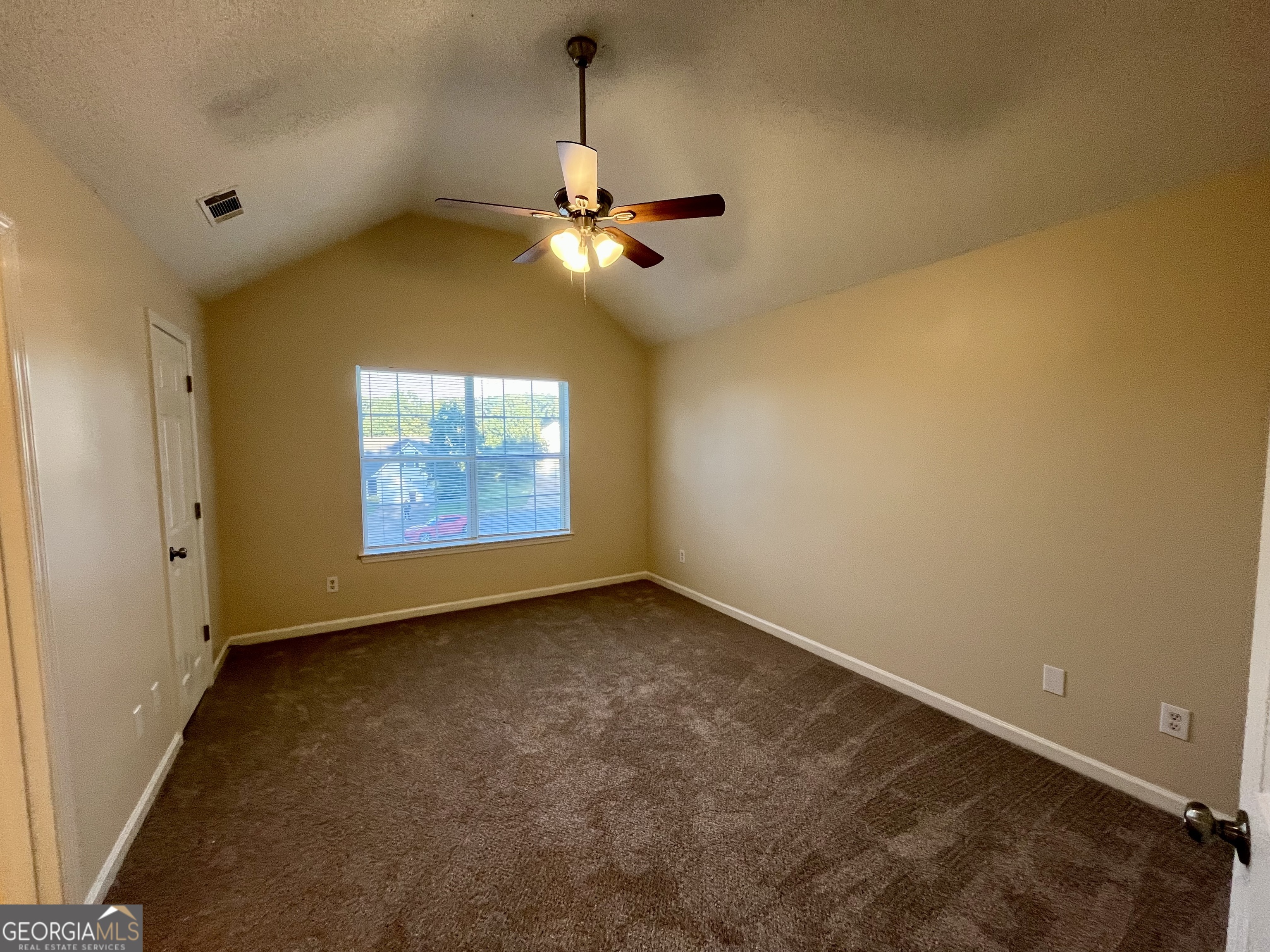260 Windscape Drive Covington, GA 30016 - Photo 7 of 14 an empty room with windows