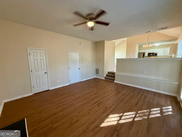 a view of an empty room and window
